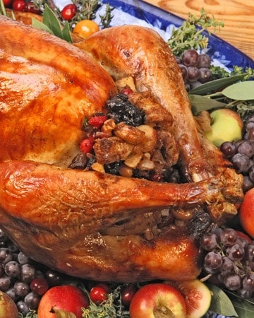 roast turkey dinner with fruit and nut stuffing that includes prunes, apricots, raisins, currants, apples, cranberries, walnuts, macadamia nuts, and cashews