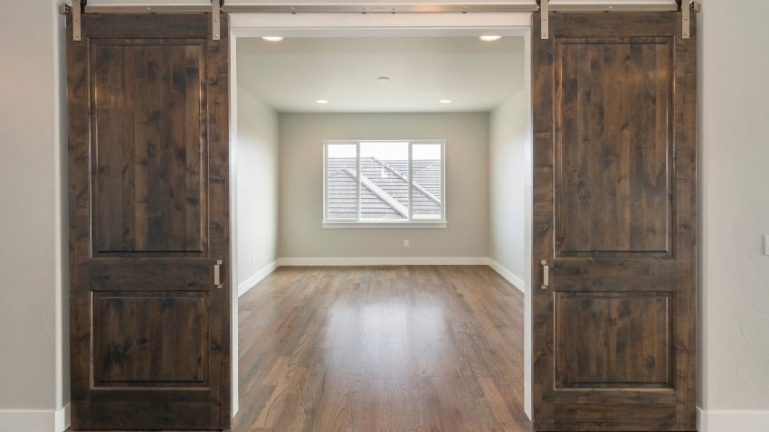 10 Beach Cottage Coastal Living Room Ideas barn door coastal look
