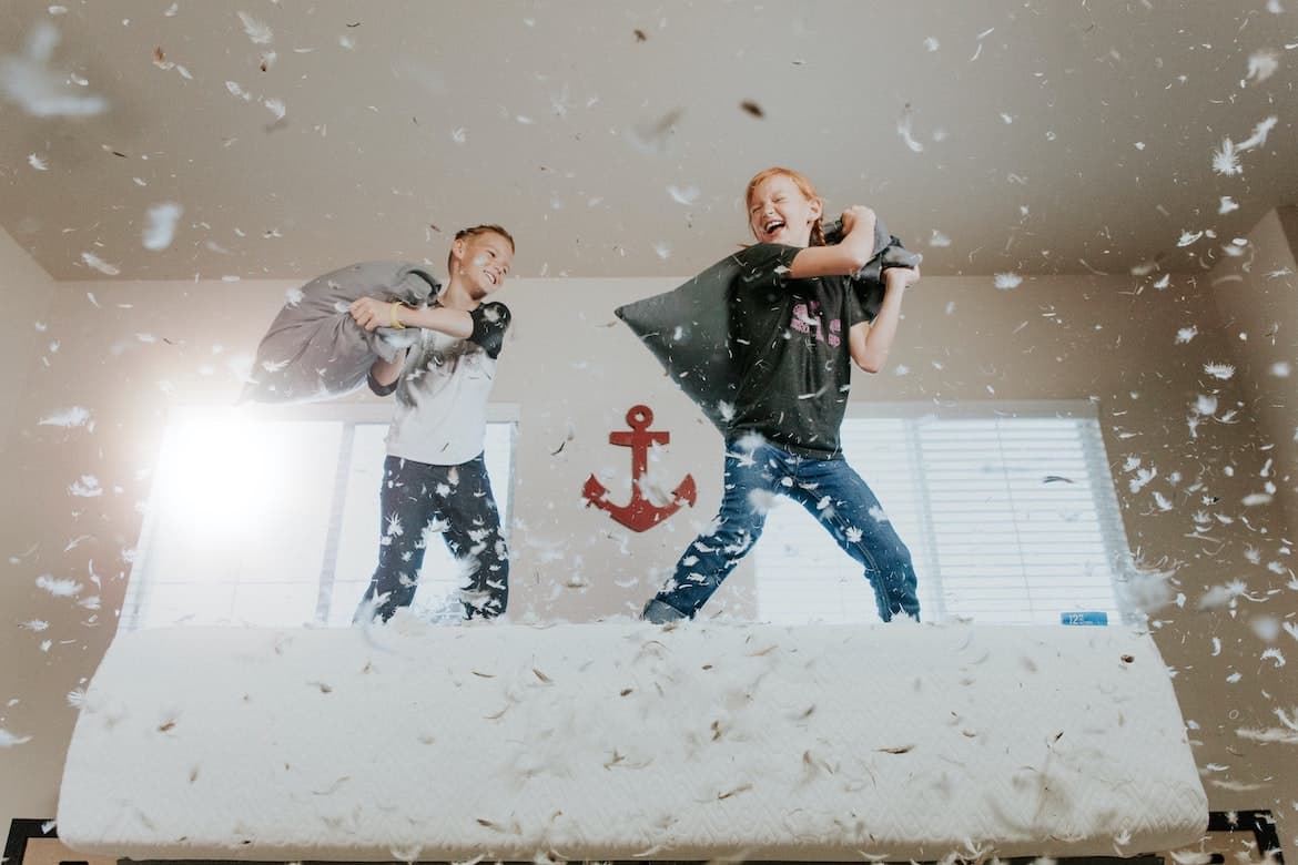 kids having a pillowfight