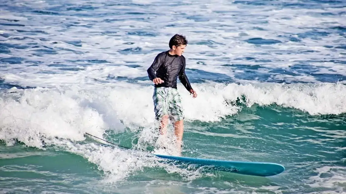 boy surfing in Los Cabos Mexico -  - The Best Surf Spots in Mexico