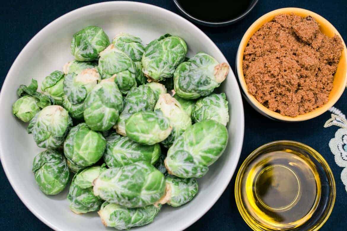 fresh uncooked brussels sprouts and ingredients for Easy Weekday Dinner Balsamic Glazed Brussels Sprouts Recipe