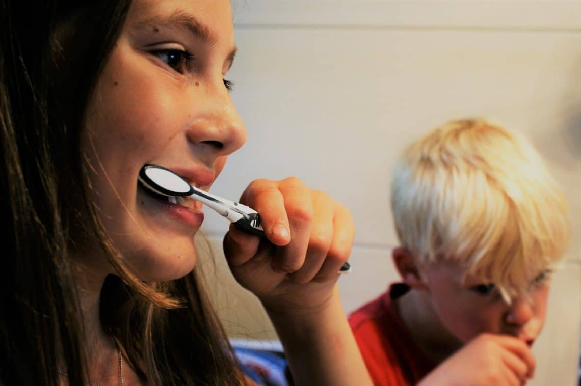 child brushing teeth