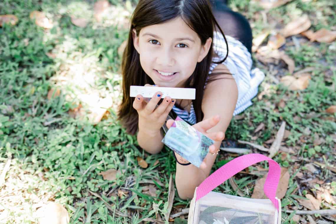 young girl holding a polaroid picture the creative way my kid is surviving deployment 