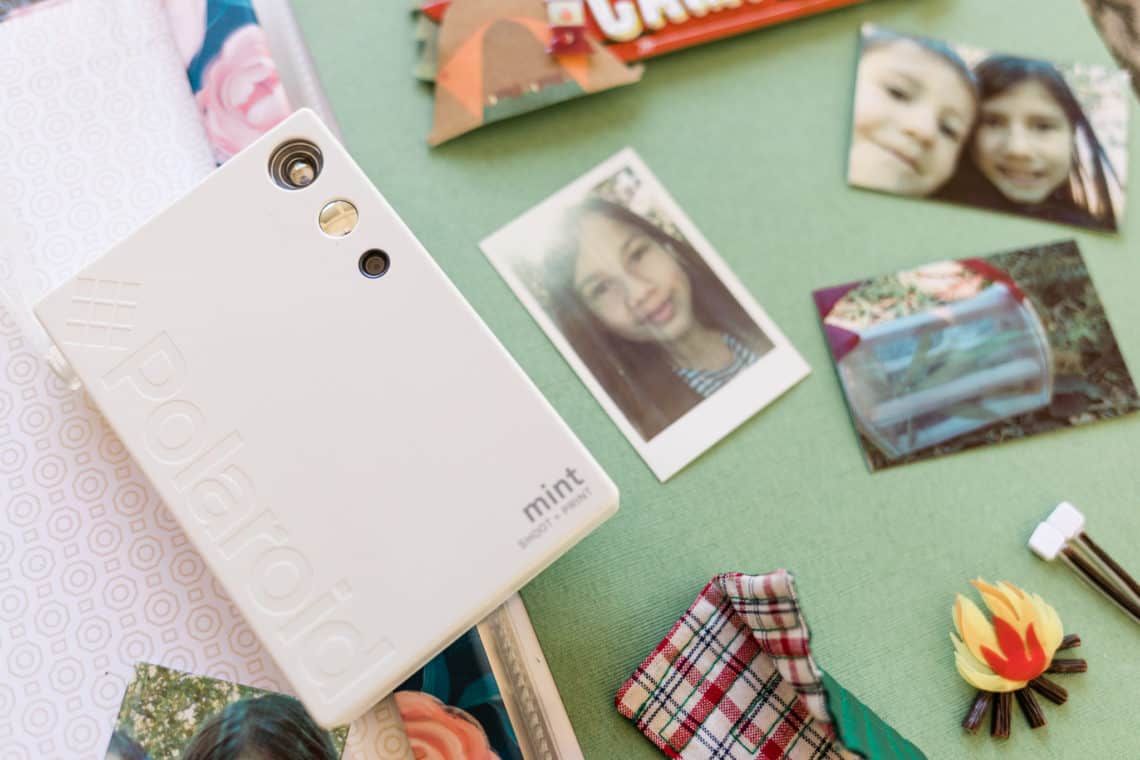 polaroid mint camera on a scrapbook for the creative way my kid is surviving deployment 