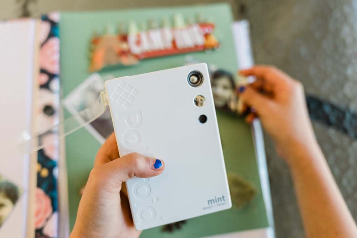 The Creative Way My Kid is Surviving Deployment with the polaroid mint camera and a scrapbook