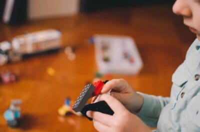 toddlers playing building block toys