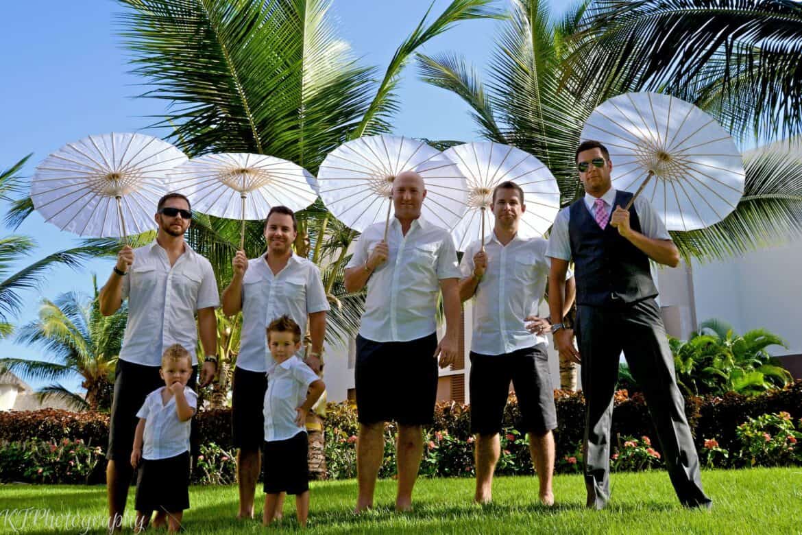 fun bridal party photo groomsmen carrying parasols