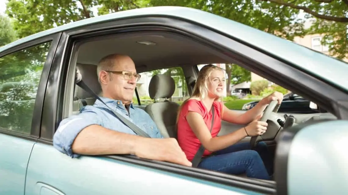 teen driving a car