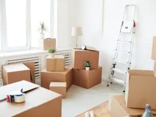 moving boxes in an empty white room