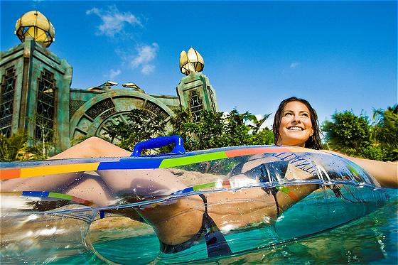 A mile-long river expedition with four-foot waves pushing inner tube riders through a densely landscaped, tropical jungle of rapids, underground tunnels, tidal waves and Tower slides. The complex transportainment system allows riders to float along the river or join in a queue for water slides without leaving their inner tubes. 