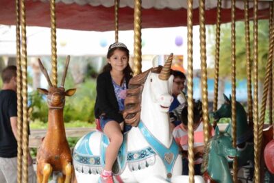 girl on carousel